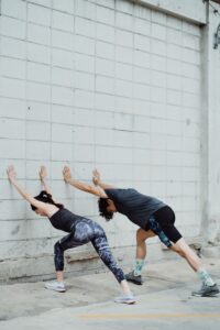 Person performing gentle back pain stretching exercises at home