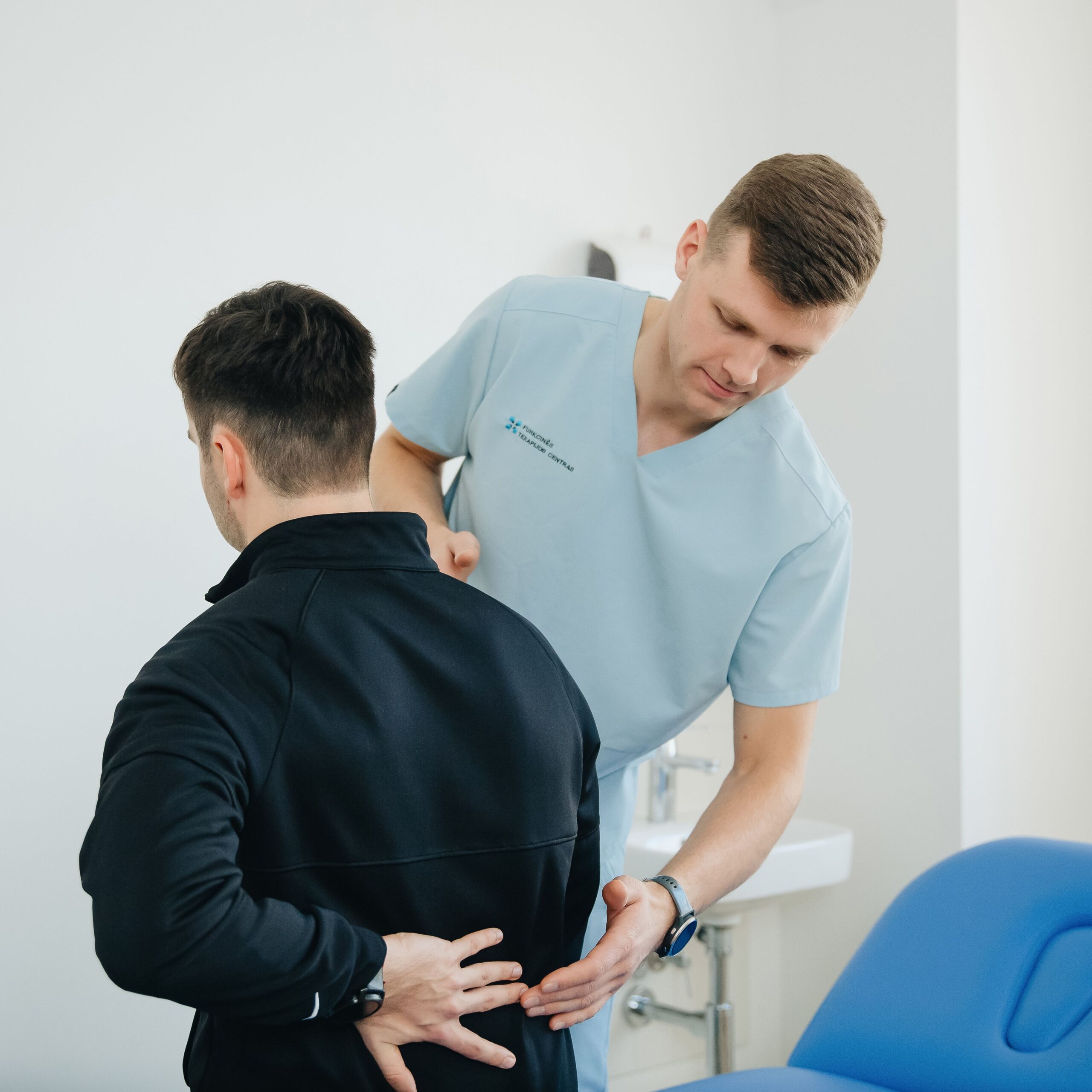 Person performing gentle back pain stretching exercises at home